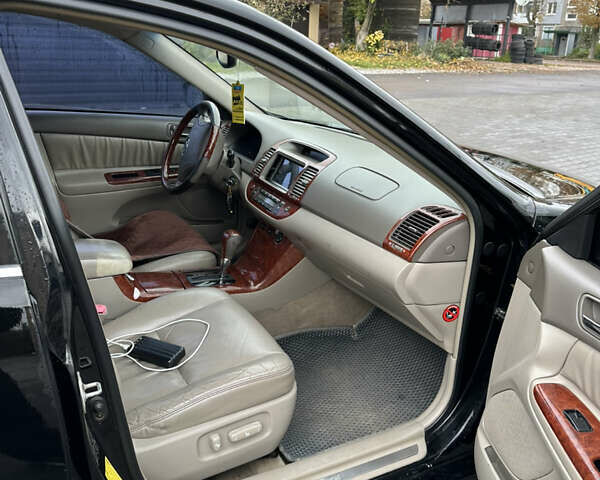 Чорний Тойота Камрі, об'ємом двигуна 2.4 л та пробігом 292 тис. км за 5350 $, фото 10 на Automoto.ua