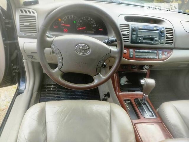 Чорний Тойота Камрі, об'ємом двигуна 3 л та пробігом 208 тис. км за 6700 $, фото 4 на Automoto.ua