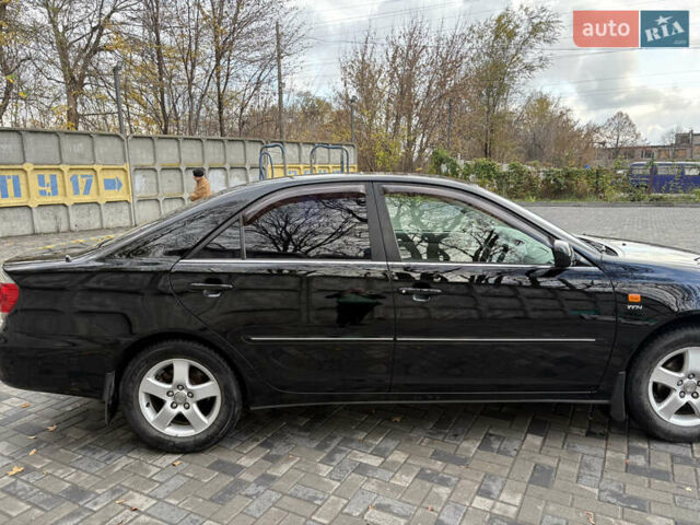 Черный Тойота Камри, объемом двигателя 2.4 л и пробегом 326 тыс. км за 6300 $, фото 6 на Automoto.ua