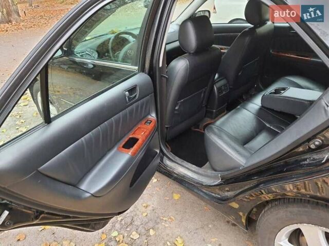 Чорний Тойота Камрі, об'ємом двигуна 3 л та пробігом 218 тис. км за 6400 $, фото 12 на Automoto.ua