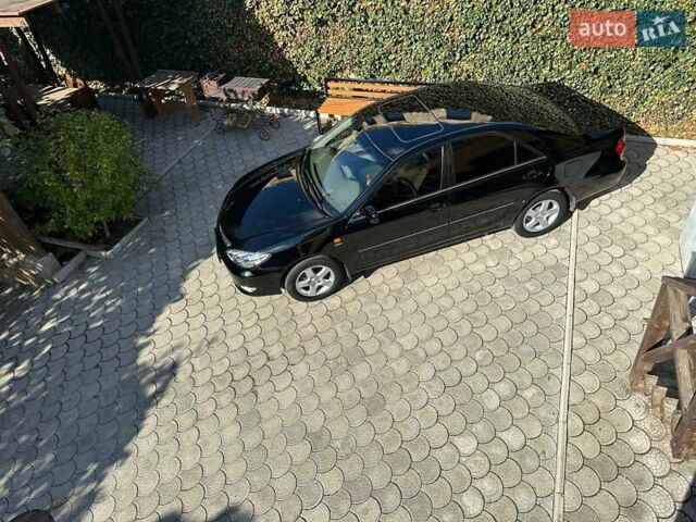 Черный Тойота Камри, объемом двигателя 2.36 л и пробегом 253 тыс. км за 6900 $, фото 1 на Automoto.ua