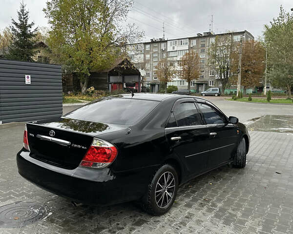 Чорний Тойота Камрі, об'ємом двигуна 2.4 л та пробігом 292 тис. км за 5350 $, фото 6 на Automoto.ua