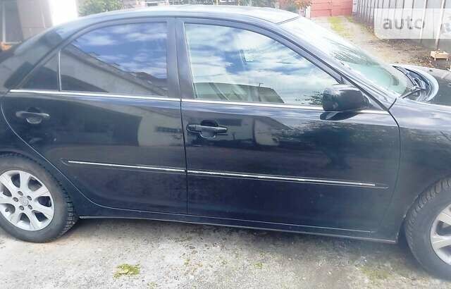 Чорний Тойота Камрі, об'ємом двигуна 3 л та пробігом 208 тис. км за 6700 $, фото 33 на Automoto.ua