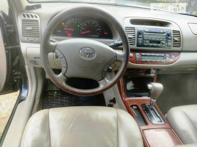 Чорний Тойота Камрі, об'ємом двигуна 3 л та пробігом 208 тис. км за 6700 $, фото 5 на Automoto.ua