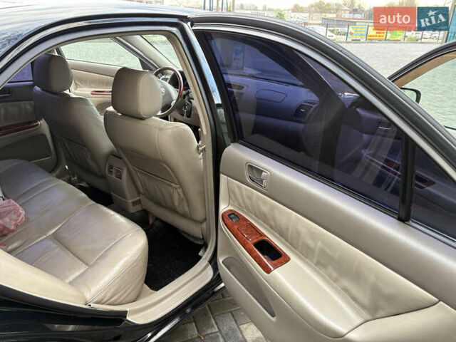 Черный Тойота Камри, объемом двигателя 2.4 л и пробегом 326 тыс. км за 6300 $, фото 16 на Automoto.ua