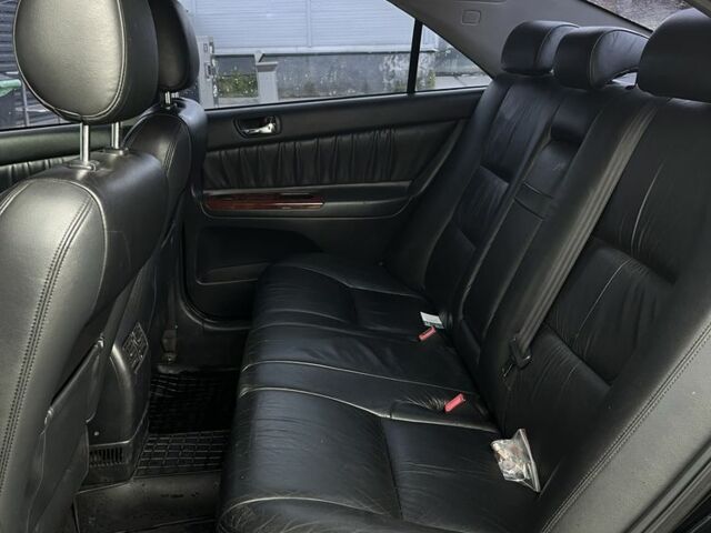 Черный Тойота Камри, объемом двигателя 2.4 л и пробегом 278 тыс. км за 5200 $, фото 12 на Automoto.ua