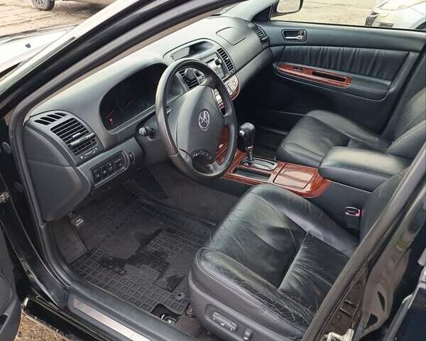 Черный Тойота Камри, объемом двигателя 3 л и пробегом 210 тыс. км за 7200 $, фото 7 на Automoto.ua