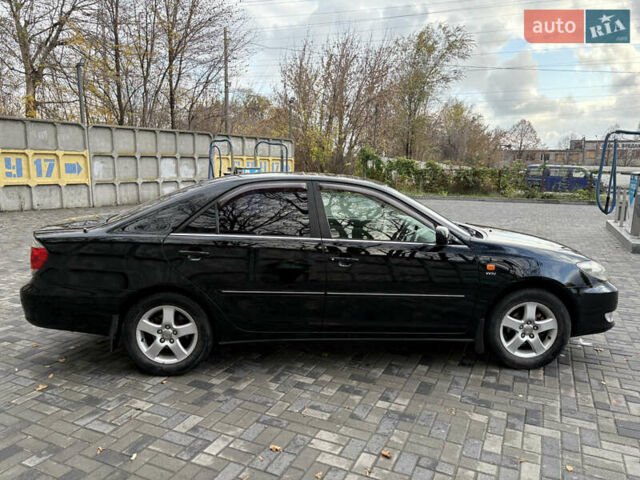 Черный Тойота Камри, объемом двигателя 2.4 л и пробегом 326 тыс. км за 6300 $, фото 7 на Automoto.ua