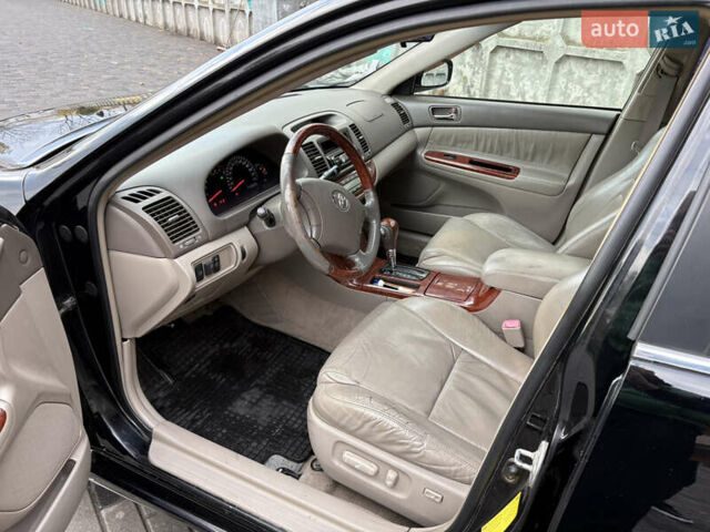 Черный Тойота Камри, объемом двигателя 2.4 л и пробегом 326 тыс. км за 6300 $, фото 10 на Automoto.ua
