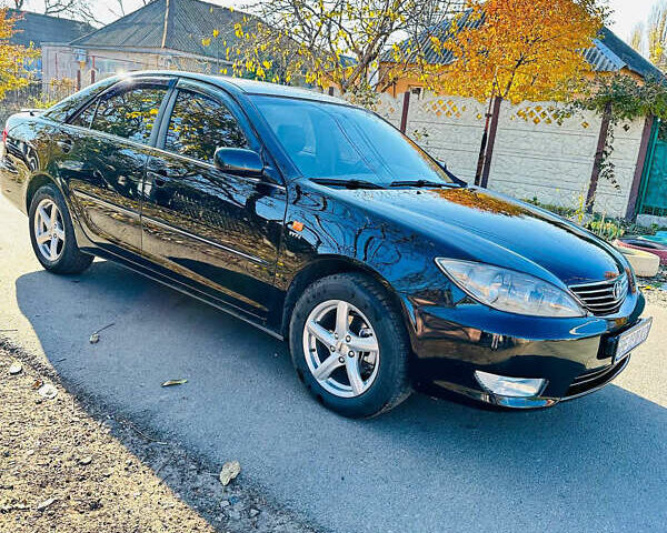Черный Тойота Камри, объемом двигателя 2.4 л и пробегом 253 тыс. км за 6100 $, фото 9 на Automoto.ua