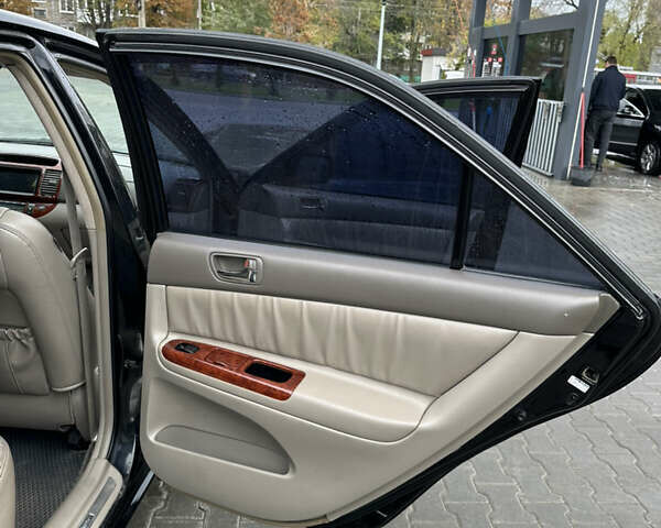 Чорний Тойота Камрі, об'ємом двигуна 2.4 л та пробігом 292 тис. км за 5350 $, фото 13 на Automoto.ua