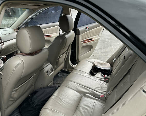 Чорний Тойота Камрі, об'ємом двигуна 2.4 л та пробігом 292 тис. км за 5350 $, фото 14 на Automoto.ua