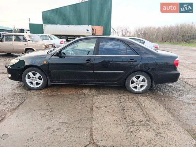 Черный Тойота Камри, объемом двигателя 3 л и пробегом 210 тыс. км за 7200 $, фото 6 на Automoto.ua