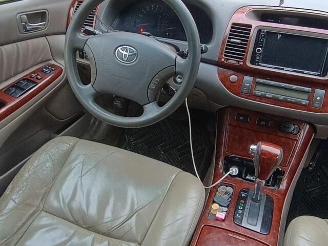 Черный Тойота Камри, объемом двигателя 2.4 л и пробегом 300 тыс. км за 5500 $, фото 4 на Automoto.ua