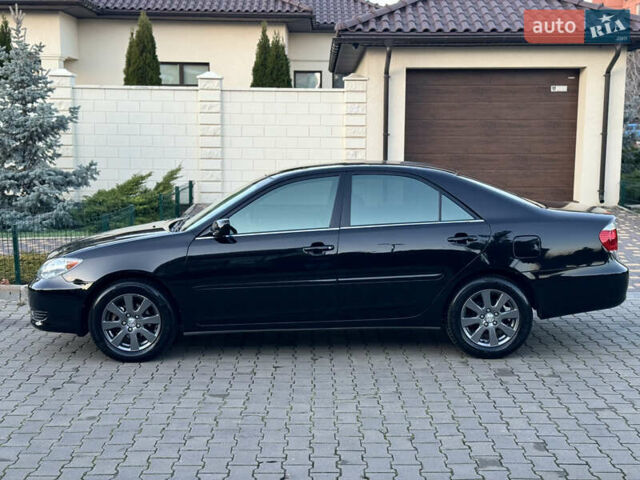 Черный Тойота Камри, объемом двигателя 2.36 л и пробегом 98 тыс. км за 8700 $, фото 11 на Automoto.ua