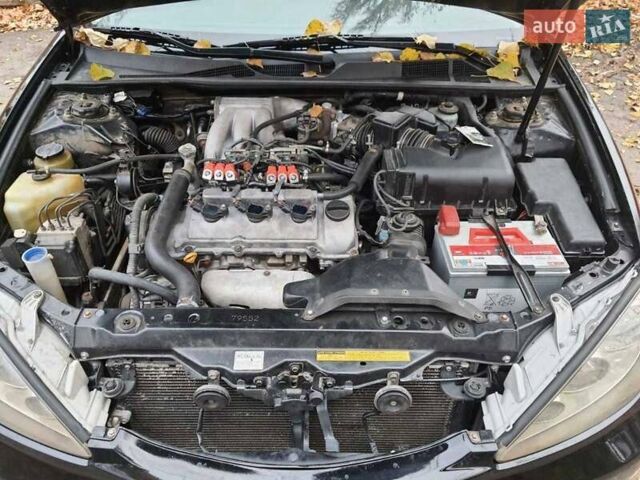 Чорний Тойота Камрі, об'ємом двигуна 3 л та пробігом 218 тис. км за 6400 $, фото 13 на Automoto.ua