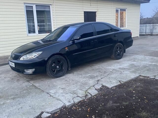 Черный Тойота Камри, объемом двигателя 2.4 л и пробегом 300 тыс. км за 7500 $, фото 7 на Automoto.ua