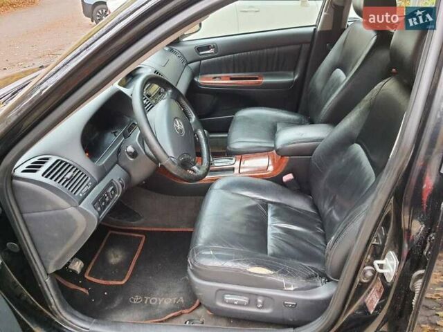 Чорний Тойота Камрі, об'ємом двигуна 3 л та пробігом 218 тис. км за 6400 $, фото 7 на Automoto.ua