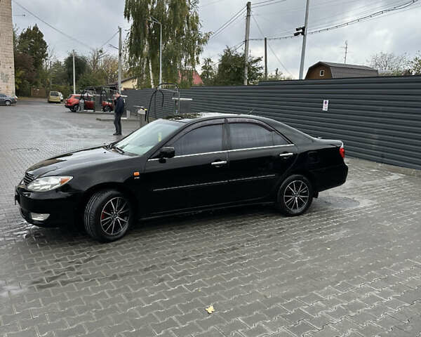Чорний Тойота Камрі, об'ємом двигуна 2.4 л та пробігом 292 тис. км за 5350 $, фото 3 на Automoto.ua