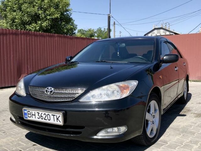 Черный Тойота Камри, объемом двигателя 2.4 л и пробегом 310 тыс. км за 5000 $, фото 4 на Automoto.ua
