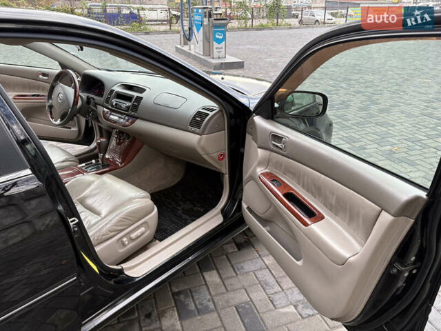 Черный Тойота Камри, объемом двигателя 2.4 л и пробегом 326 тыс. км за 6300 $, фото 14 на Automoto.ua