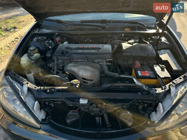 Черный Тойота Камри, объемом двигателя 2.4 л и пробегом 253 тыс. км за 6100 $, фото 3 на Automoto.ua