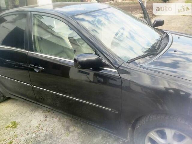 Чорний Тойота Камрі, об'ємом двигуна 3 л та пробігом 208 тис. км за 6700 $, фото 18 на Automoto.ua