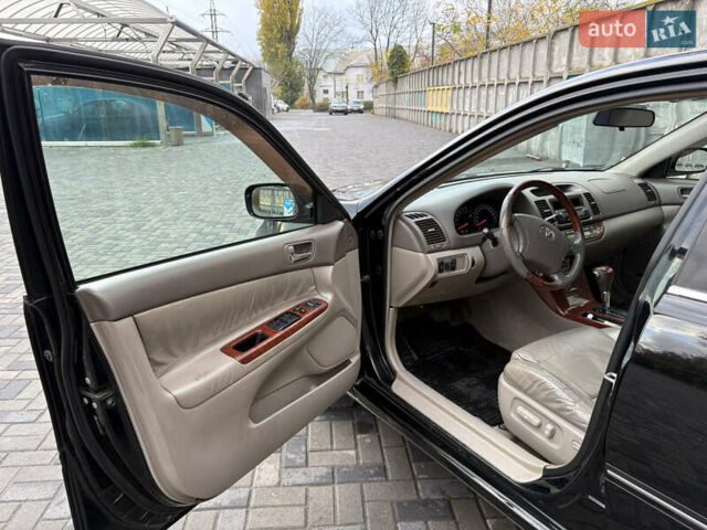 Черный Тойота Камри, объемом двигателя 2.4 л и пробегом 326 тыс. км за 6300 $, фото 9 на Automoto.ua