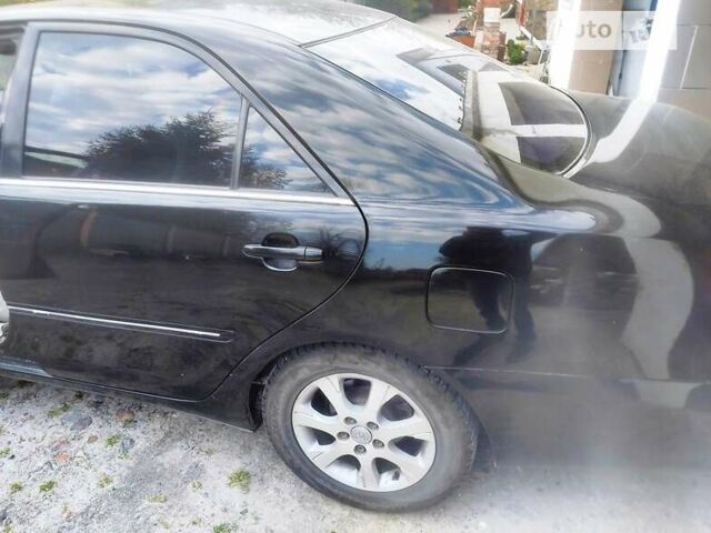 Чорний Тойота Камрі, об'ємом двигуна 3 л та пробігом 208 тис. км за 6700 $, фото 31 на Automoto.ua