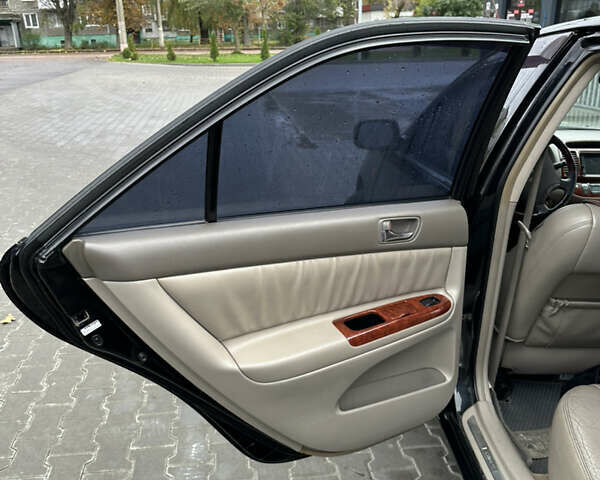 Чорний Тойота Камрі, об'ємом двигуна 2.4 л та пробігом 292 тис. км за 5350 $, фото 15 на Automoto.ua