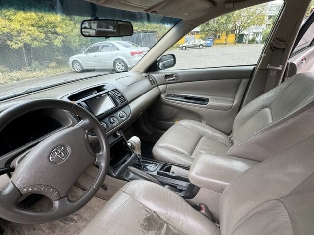 Черный Тойота Камри, объемом двигателя 2.4 л и пробегом 180 тыс. км за 6000 $, фото 10 на Automoto.ua