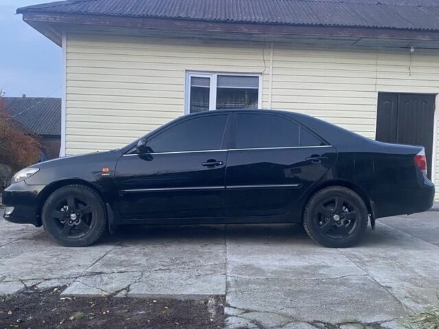 Черный Тойота Камри, объемом двигателя 2.4 л и пробегом 300 тыс. км за 7500 $, фото 6 на Automoto.ua