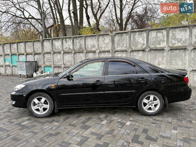 Черный Тойота Камри, объемом двигателя 2.4 л и пробегом 326 тыс. км за 6300 $, фото 2 на Automoto.ua