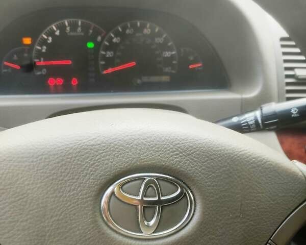 Чорний Тойота Камрі, об'ємом двигуна 3 л та пробігом 208 тис. км за 6700 $, фото 2 на Automoto.ua