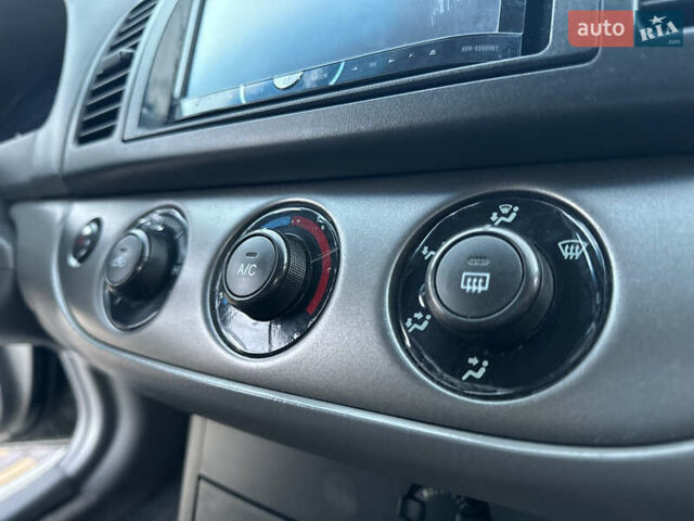 Черный Тойота Камри, объемом двигателя 2.36 л и пробегом 98 тыс. км за 8700 $, фото 79 на Automoto.ua