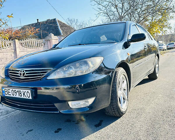 Черный Тойота Камри, объемом двигателя 2.4 л и пробегом 253 тыс. км за 6100 $, фото 2 на Automoto.ua