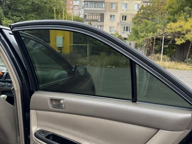 Черный Тойота Камри, объемом двигателя 2.4 л и пробегом 180 тыс. км за 6000 $, фото 16 на Automoto.ua