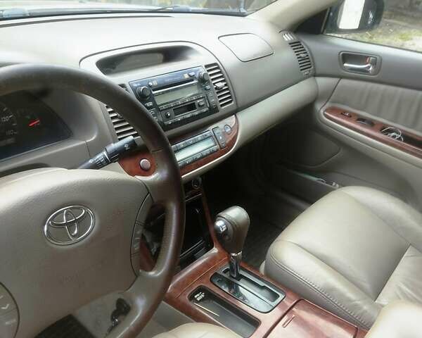 Чорний Тойота Камрі, об'ємом двигуна 3 л та пробігом 208 тис. км за 6700 $, фото 1 на Automoto.ua