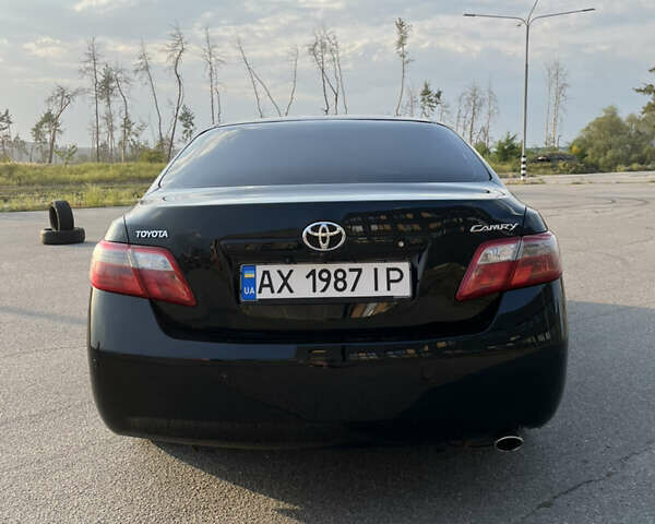 Черный Тойота Камри, объемом двигателя 2.4 л и пробегом 249 тыс. км за 9700 $, фото 13 на Automoto.ua