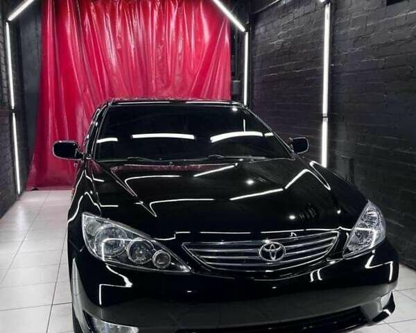 Чорний Тойота Камрі, об'ємом двигуна 2.36 л та пробігом 270 тис. км за 6100 $, фото 1 на Automoto.ua