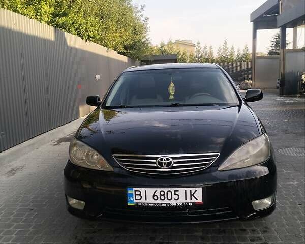 Чорний Тойота Камрі, об'ємом двигуна 2.4 л та пробігом 313 тис. км за 7200 $, фото 3 на Automoto.ua