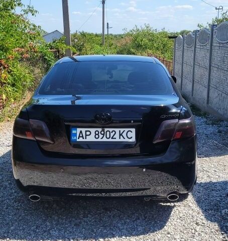 Черный Тойота Камри, объемом двигателя 3.5 л и пробегом 300 тыс. км за 7500 $, фото 1 на Automoto.ua