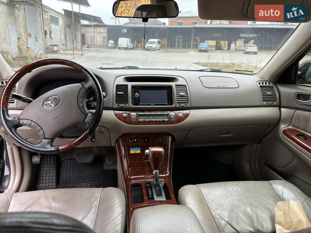 Чорний Тойота Камрі, об'ємом двигуна 2.36 л та пробігом 294 тис. км за 5100 $, фото 13 на Automoto.ua