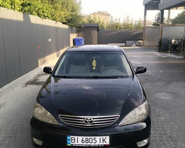 Чорний Тойота Камрі, об'ємом двигуна 2.4 л та пробігом 313 тис. км за 7200 $, фото 6 на Automoto.ua