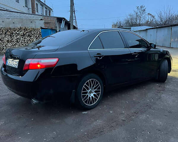 Черный Тойота Камри, объемом двигателя 3.46 л и пробегом 264 тыс. км за 9800 $, фото 3 на Automoto.ua