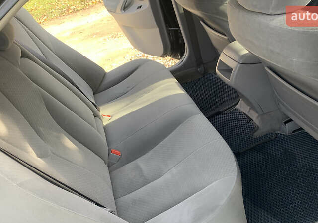 Чорний Тойота Камрі, об'ємом двигуна 2.4 л та пробігом 274 тис. км за 7500 $, фото 5 на Automoto.ua