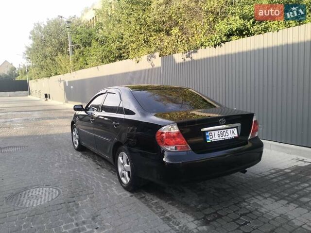 Чорний Тойота Камрі, об'ємом двигуна 2.4 л та пробігом 313 тис. км за 7200 $, фото 7 на Automoto.ua