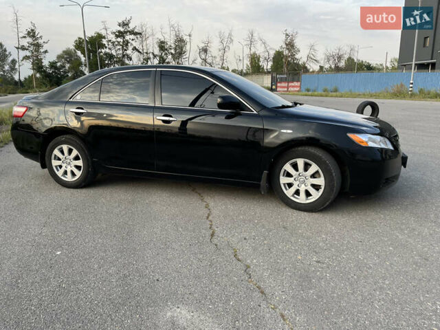 Черный Тойота Камри, объемом двигателя 2.4 л и пробегом 249 тыс. км за 9700 $, фото 1 на Automoto.ua