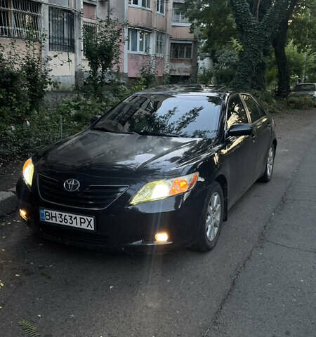 Черный Тойота Камри, объемом двигателя 2.36 л и пробегом 243 тыс. км за 6900 $, фото 1 на Automoto.ua