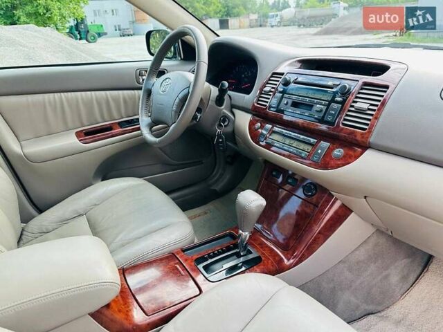 Черный Тойота Камри, объемом двигателя 3 л и пробегом 195 тыс. км за 6900 $, фото 18 на Automoto.ua